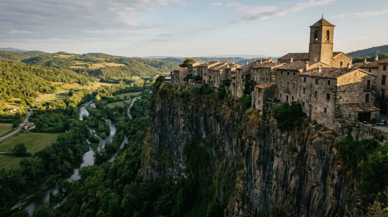 Castellfollit de la Roca village on its basalt cliff on a medieval towns day trip from Barcelona, Catalonia